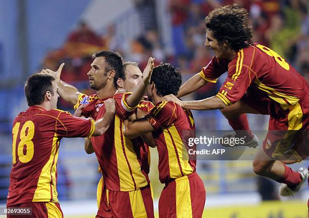 Montenegrin Mirko Vucinic celebrates with his teammates his goal against Bulgaria during their World Cup 2010 qualifying football match in Podgorica...