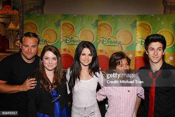 Actors David DeLuise, Jennifer Stone, Selena Gomez, Jake T. Austin and David Henrie cast of "Wizards of Waverly Place" visits the World of Disney on...