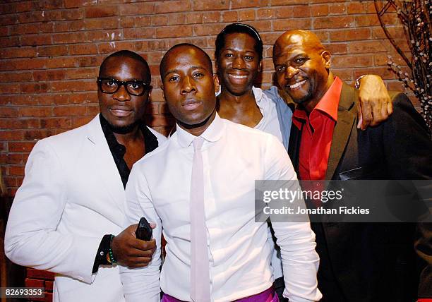 Manager Jason Lewis, designer Nana Boateng, runway coach J. Alexander and actor Terry Crews pose backstage prior to Boateng's Spring 2009 show at the...