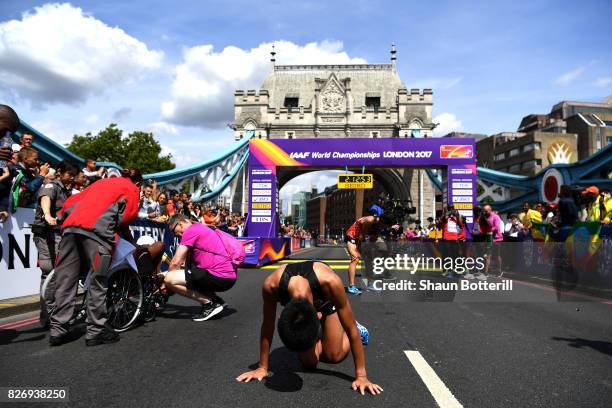 Hiroto Inoue of Japan reacts after crossing the finishline in the Men's Marathon during day three of the 16th IAAF World Athletics Championships...