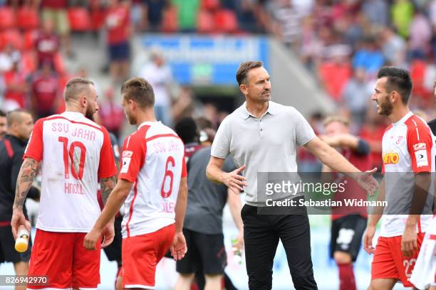 Head coach Achim Beierlorzer of SSV Jahn Regensburg talks to his players after the Second Bundesliga match between SSV Jahn Regensburg and 1. FC...