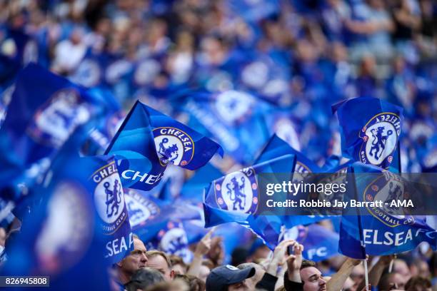 Fans of Chelsea wave flags during the The FA Community Shield between Chelsea and Arsenal at Wembley Stadium on August 6, 2017 in London, England.