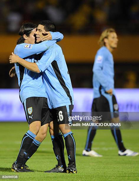 Uruguay national football team players Maximiliano Pereira and Alvaro Gonzalez celebrate after defeating Colombia for their FIFA World Cup South...