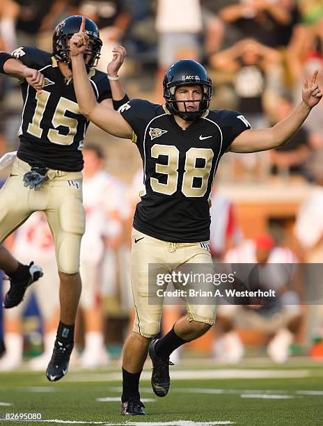 Kicker Sam Swank and holder Ryan McManus of the Wake Forest Demon Deacons celebrate following Swank's 41-yard game winning field goal against the Ole...