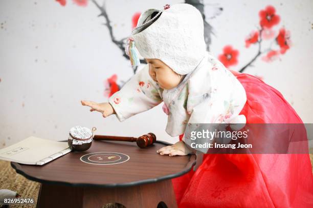 doljabi ceremony (a korean first birthday celebration) - korean tradition stock pictures, royalty-free photos & images