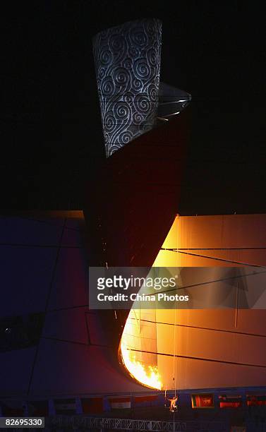 Chinese gold medallist Hou Bin lights the Paralympics flame during the Opening Ceremony of the Beijing 2008 Paralympic Games at the National Stadium...