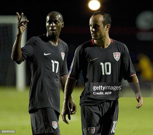 S Landon Donovan and Bradley Damascus celebrate their victory at the end of their FIFA World Cup South Africa-2010 qualifier football match against...