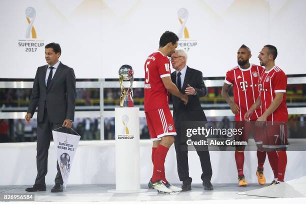 Dortmund CEO Hans-Joachim Watzke congratulates Mats Hummels of Muenchen after Bayern Muechen has won the DFL Supercup 2017 match between Borussia...