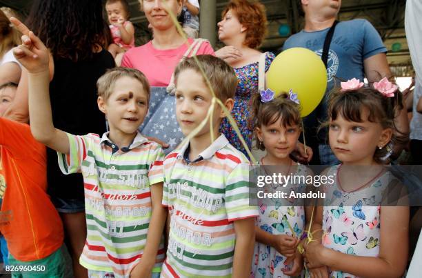 Children twins attend "Double Happiness" with their parents at the National Complex within "Expocenter of Ukraine" in Kiev, Ukraine, on August 06,...