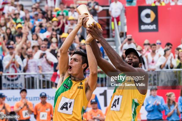 Andre Loyola Stein and Evandro Goncalves Oliveira Junior of Brazil celebrate first place at FIVB Beach Volleyball World Championships on August 6,...