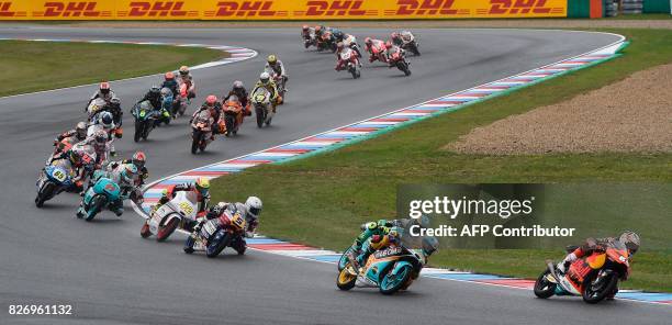 Moto3 drivers compete during the Moto3 event of the Grand Prix of the Czech Republic in Brno on August 6, 2017. / AFP PHOTO / Michal Cizek