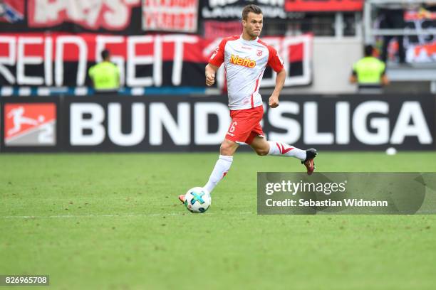 Benedikt Saller of SSV Jahn Regensburg plays the ball during the Second Bundesliga match between SSV Jahn Regensburg and 1. FC Nuernberg at...