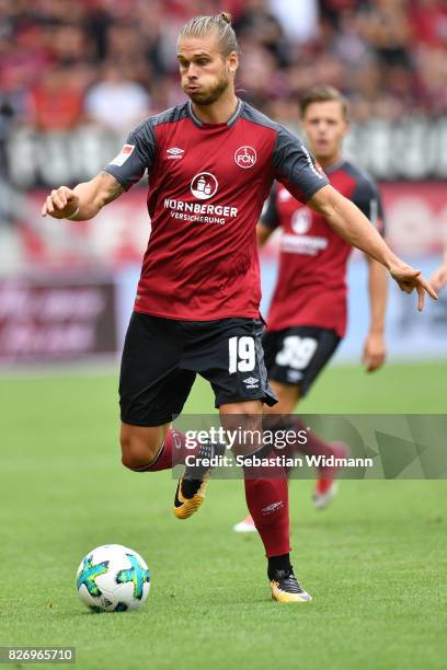 Rurik Gislason of 1. FC Nuernberg plays the ball during the Second Bundesliga match between SSV Jahn Regensburg and 1. FC Nuernberg at Continental...