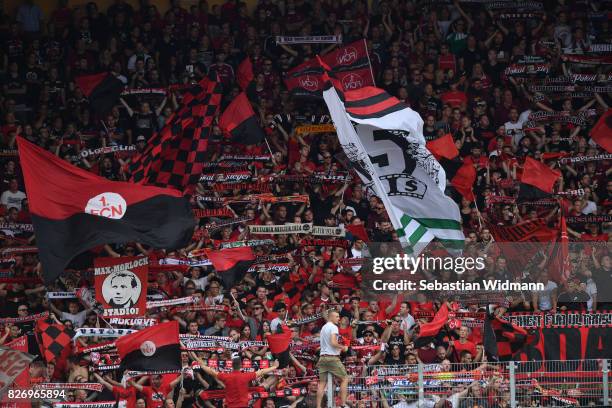 Supporters of 1. FC Nuernberg cheer for their team during the Second Bundesliga match between SSV Jahn Regensburg and 1. FC Nuernberg at Continental...