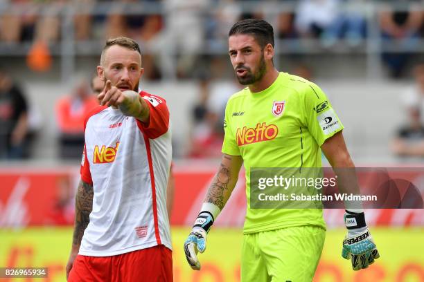 Marvin Knoll and goalkeeper Philipp Pentke of SSV Jahn Regensburg talk during the Second Bundesliga match between SSV Jahn Regensburg and 1. FC...