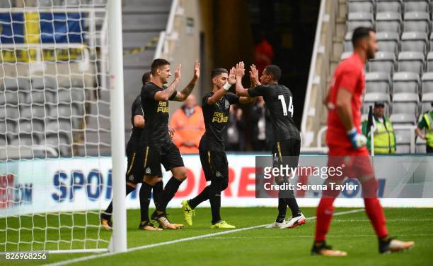 Ayoze Perez of Newcastle United celebrates with teammates after scoring the opening goal during the Pre Season Friendly match between Newcastle...