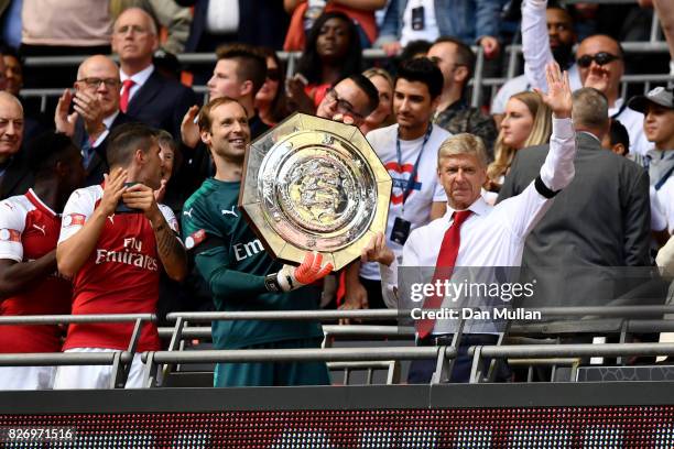 Petr Cech of Arsenal and Arsenal manager Arsene Wenger celebrate with the trophy following the The FA Community Shield final between Chelsea and...