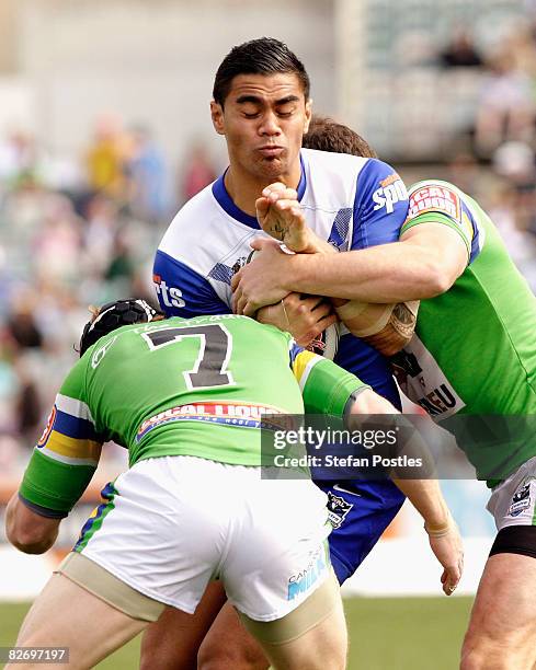 Frank Winterstein of the Bulldogs is tackled during the round 26 NRL match between the Canberra Raiders and the Bulldogs at Canberra Stadium on...