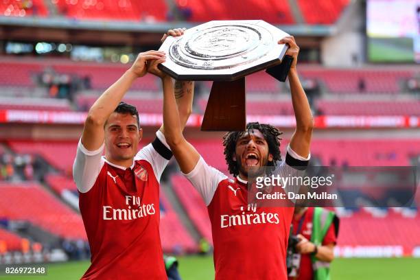Granit Xhaka of Arsenal and Mohamed Elneny of Arsenal celebrate with the trophy following the The FA Community Shield final between Chelsea and...