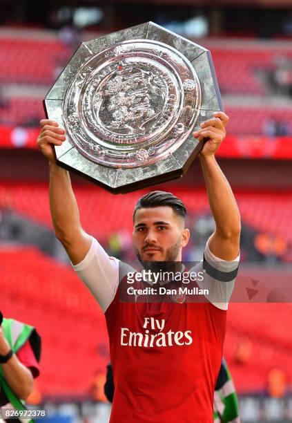 Sead Kolasinac of Arsenal celebrates with the trophy following the The FA Community Shield final between Chelsea and Arsenal at Wembley Stadium on...