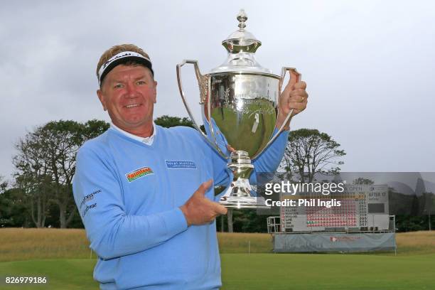 Paul Broadhurst of England poses with the trophy after the final round of the Scottish Senior Open at The Renaissance Club on August 6, 2017 in North...