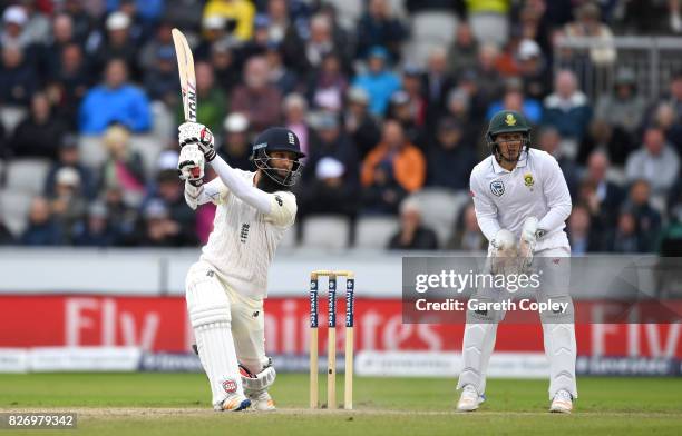 Moeen Ali of England bats watched by South Africa wicketkeeper Quinton de Kock during day three of the 4th Investec Test match between England and...