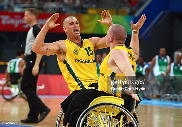 Brad Ness and Shaun Norris celebrate during the Wheelchair Basketball match between Australia and Brazil at the National Indoor Stadium on September...