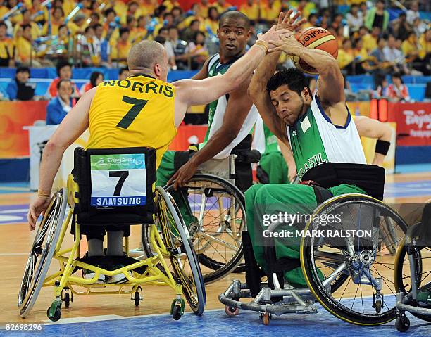 Shaun Norris of Australia blocks a shot from Irio Nunes of Brazil during their Group B basketball game at the 2008 Beijing Paralympic Games on...