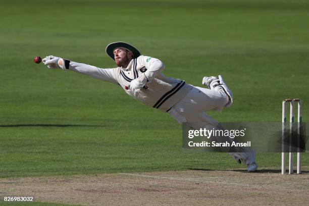 Adam Rouse Fs8 Kent wicket keeper Adam Rouse dives in an attempt to field the ball ...