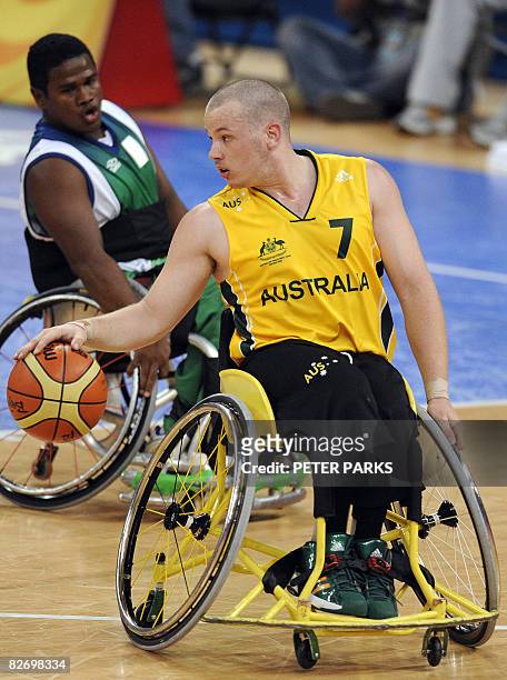 Shaun Norris of Australia dribbles the ball against Brazil in their Group B basketball game at the 2008 Beijing Paralympic Games on September 7,...