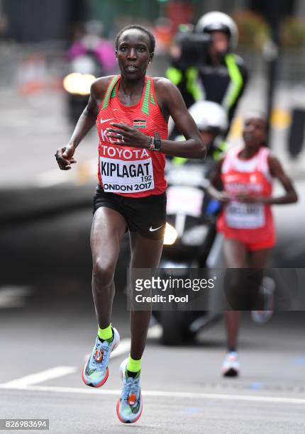 Kenya's Edna Ngeringwony Kiplagat leads Bahrain's Rose Chelimo in the Women's Marathon during day three of the 16th IAAF World Athletics...