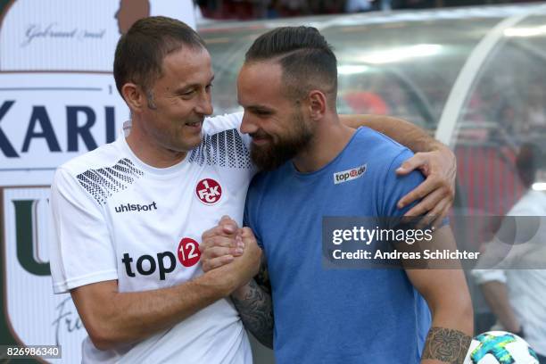 Frank Saenger and Giuliano Modica of Kaiserslautern during the Second Bundesliga match between 1. FC Kaiserslautern and SV Darmstadt 98 at...