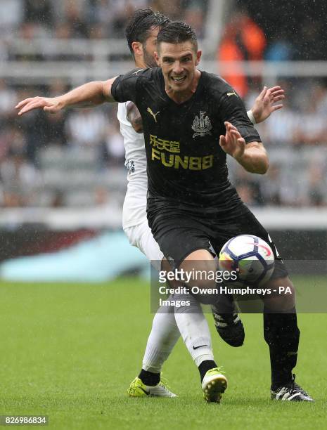Newcastle United's Ciaran Clark is fouled by Hellas Verona's Daniel Bessa during the pre-season friendly at St Jamesâ Park, Newcastle.