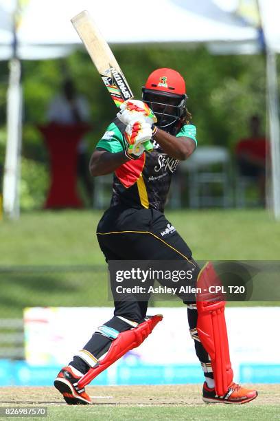 In this handout image provided by CPL T20, Chris Gayle of St Kitts and Nevis Patriots plays the ball through the onside during Match 4 of the 2017...