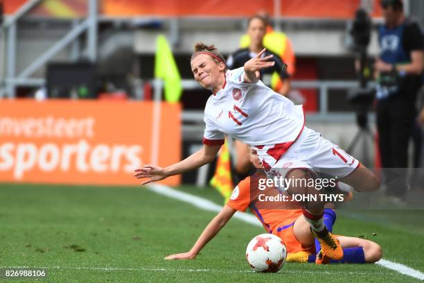 Netherlands' midfielder Jackie Groenen vies for the ball with Denmark's midfielder Katrine Veje during the UEFA Womens Euro 2017 football tournament...