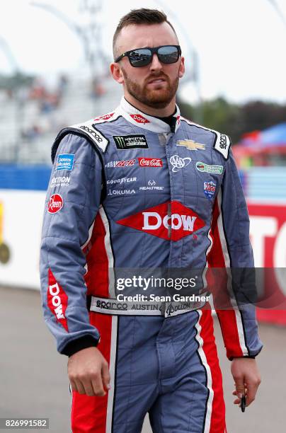 Austin Dillon, driver of the Dow STEM Chevrolet, walks down pit road during qualifying for the Monster Energy NASCAR Cup Series I Love NY 355 at The...