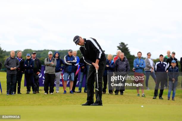 Mike Harwood of Australia in action on the 1st tee in the final round of the Scottish Senior Open at The Renaissance Club on August 6, 2017 in North...