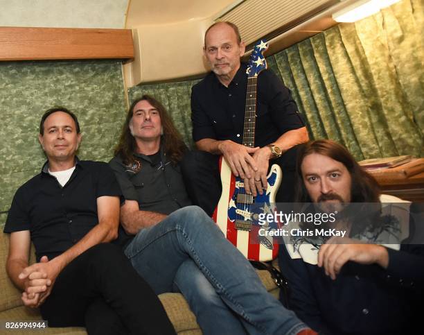 Wayne Kramer and his band members Adam Renshaw, Shannon Mulvaney, and Adam McIntyre wait backstage to perform during the Artist2Artist benefit for...