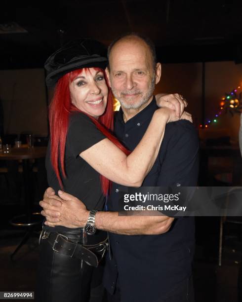 Actress Lisa Mende and Musician Wayne Kramer after the Artist2Artist Benefit For Homeless Veterans at The Office on August 5, 2017 in Athens, Georgia.