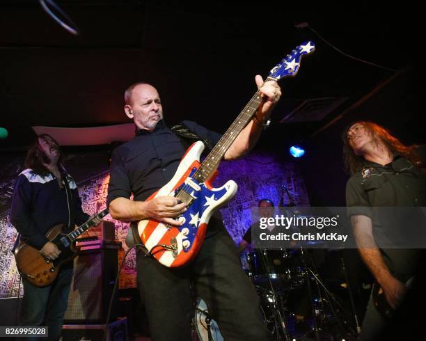 Adam McIntyre, Wayne Kramer, Adam Renshaw, and Shannon Mulvaney perform during the Artist2Artist Benefit For Homeless Veterans at The Office on...