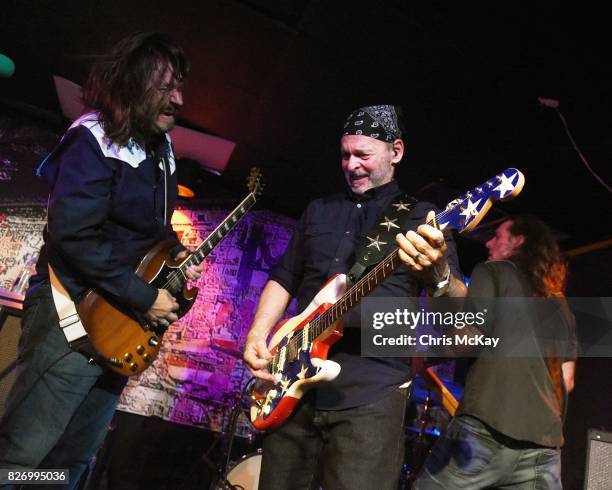 Adam McIntyre, Wayne Kramer, and Shannon Mulvaney perform during the Artist2Artist Benefit For Homeless Veterans at The Office on August 5, 2017 in...