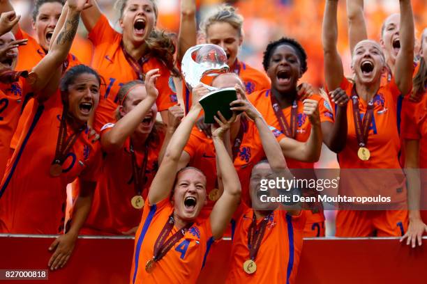 Mandy van den Berg of the Netherlands and Sherida Spitse of the Netherlands lift the trophy following the Final of the UEFA Women's Euro 2017 between...