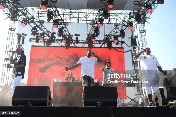 Rappers Kryazie Bone, Flesh-n-Bone, Layzie Bone and Wish Bone of Bone Thugs N Harmony perform onstage during Summertime in the LBC festival on August...