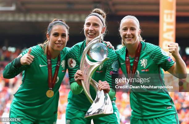 Angela Christ , Sari van Veenendaal and Loes Geurts of The Netherlands celebrate with the trophy following the Final of the UEFA Women's Euro 2017...