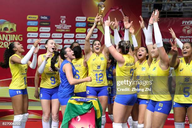 Players of Brazil celebrate with trophy after winning the final match between Brazil and Italy during 2017 Nanjing FIVB World Grand Prix Finals on...