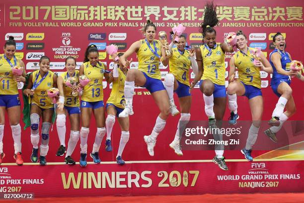 Players of Brazil celebrate winning with trophy after winning the final match between Brazil and Italy during 2017 Nanjing FIVB World Grand Prix...