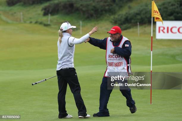 Jodi Ewart Shadoff of England reacts with her caddie on the 18th green during the final round of the Ricoh Women's British Open at Kingsbarns Golf...