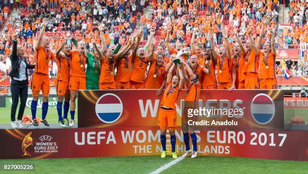 Players of Netherlands lift the trophy as they celebrate after winning the UEFA Women's Euro 2017 final between Netherlands and Denmark at FC Twente...