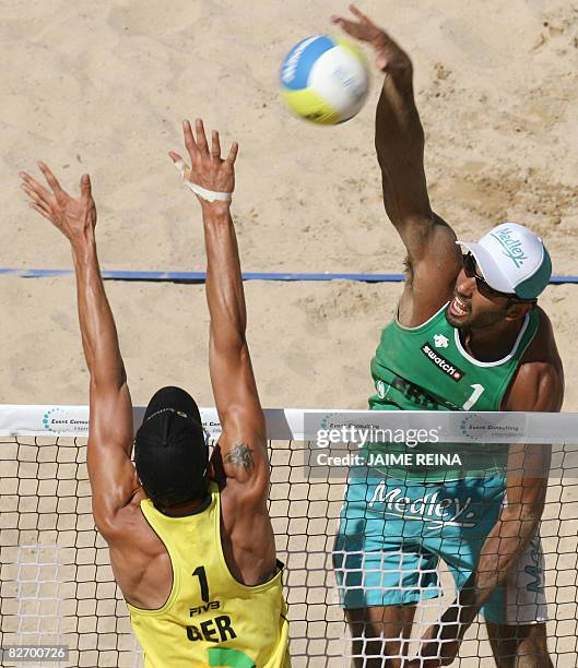 Brazilian Pedro Solberg spikes the ball against Germany's Eric Koerng during the final of the FIVB Beach Volley World Tour tournament in Palma de...