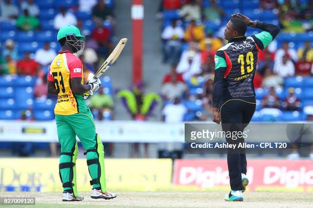 In this handout image provided by CPL T20, Sheldon Cottrell of St Kitts and Nevis Patriots celebrate the dismissal of Chadwick Walton of the Guyana...